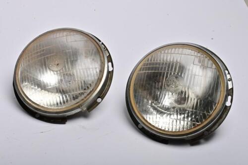 LUCAS: Two Lucas 7" '700' headlamp and holders