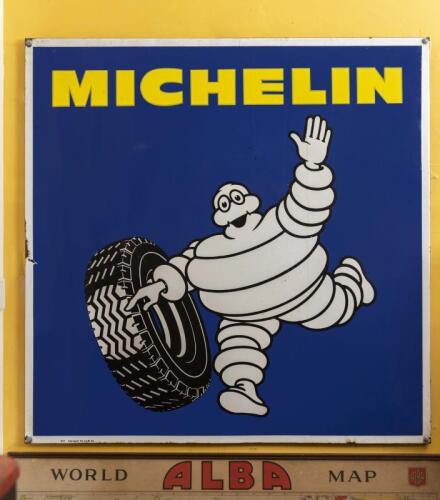 MICHELIN: A large circa 1950s "Michelin" featuring Bibendum enamel advertising sign, 95cm square