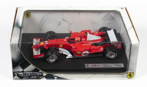 FERRARI: A 1:18 scale Hot Wheels F1 Ferrari 248 as raced by Michael Schumacher, Sponsored by Vodafone, AMD, Bridgestone, Shell, Fiat, and more, #5, in fitted box