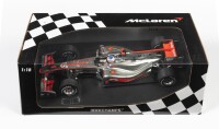 MCLAREN: A 1:18 scale Minichamps F1 McLaren Mercedes MP4-25 as raced by Jenson Button in 2010, #1, Vodafone team, in fitted box