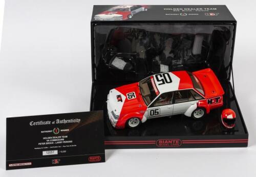 COMMODORE: A 1:18 scale Biante Holden VK Commodore, Holden Dealer Team as raced by Peter Brock/Larry Perkins in 1984 Hardie- Ferodo 1000 Winner, #05, with a helmet model, with COA numbered 12057/15000, in fitted box
