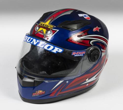 HELMET: A full faced blue motorcycle with applied racing stickers, size unknown