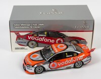 FALCON: A limited edition 1:18 scale Classic Carlectables Ford FG Falcon as raced by Jamie Whincup in 2009 Team Vodafone FG Falcon, #1, with COA numbered 978/1500, spoiler broken and missing also windshield broken, in double fitted box