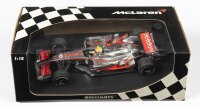 MCLAREN: A 1:18 scale Minichamps F1 McLaren MP4-23 as raced by Lewis Hamilton in 2008, #22, Team Vodafone, in fitted box