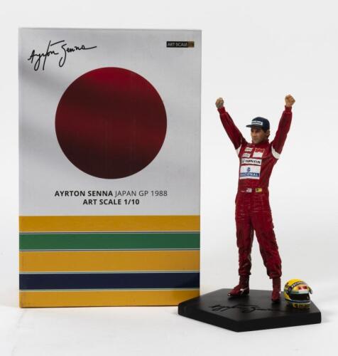 AYRTON SENNA: A limited edition 1073/1988 figure Ayrton Senna Japan GP 1988, art scale 1/10 (24cm x 14cm), handpainted polystyrene includes base containing his helmet and trophy, in fitted box