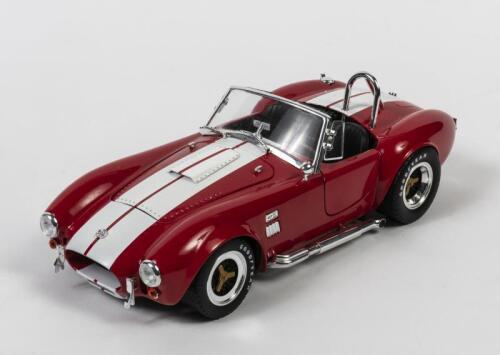 COBRA: A 1:18 scale Collectibles INC Shelby Cobra 427 S/C, red with white stripes, no box