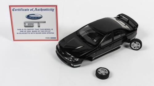 FALCON: A 1:18 scale Biante Ford Falcon GT FPV, plain body black with silver stripes, with two non original wheels and two wheels repaired with glue, with COA numbered 500/2000, no box