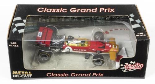 LOTUS: A 1:18 scale Quartzo F1 Lotus 49C as raced by Jochen Rindt in 1970 Grand Prix of Monaco, #3, the model is numbered 483/2500, in damage fitted box