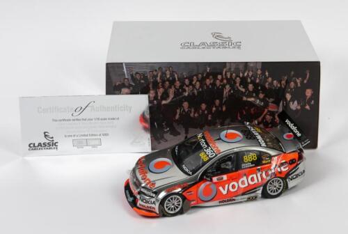 COMMODORE: A limited edition 1:18 scale Classic Carlectables Holden VE Commodore as raced by Craig Lowndes/Mark Skaife in 2010 Supercheap Auto Bathurst 1000 winner, Team Vodafone, with COA numbered2850/5000, replica trophy included inside, in double fitte