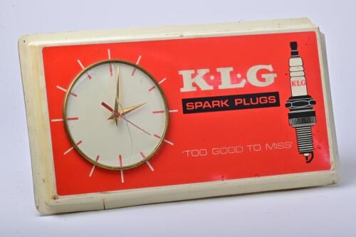 KLG: An original KLG clock mounted in moulded plastic sign, 23cm high, 44cm wide, 9cm deep