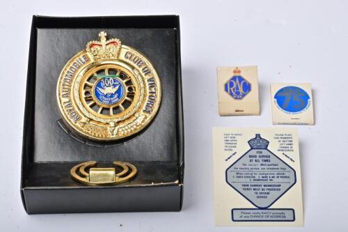 RACV: A collection of RACV items comprising a boxed commemorative centennial grille badge, transfer sticker and two books of matches