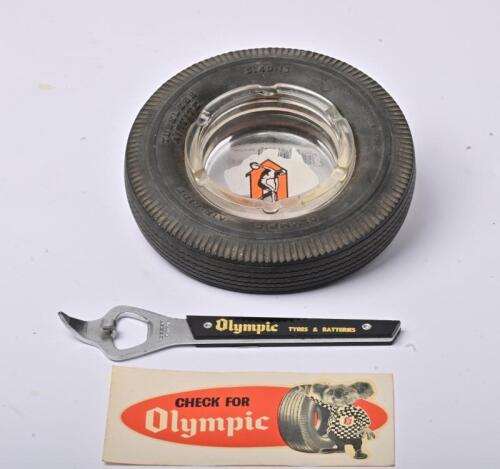 OLYMPIC: A group of Olympic tyres related promotional items a novelty tyre form ashtray, bottle opener and unused sticker, the ashtray 15cm diameter