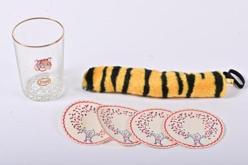 ESSO: A group of Esso items, comprising a gilt rim glass, four paper coasters and a Tony the Tiger's tail (to be hung from the petrol cap to denote the "Tiger in the Tank")