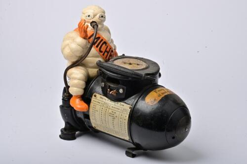 MICHELIN: A small French circa 1928 110 volt Bibendum figured compressor in original condition, broken bezel and lacking glass cover