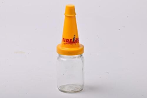 FIREZONE: A large NOS Firezone oil bottle with plastic pourer and cap