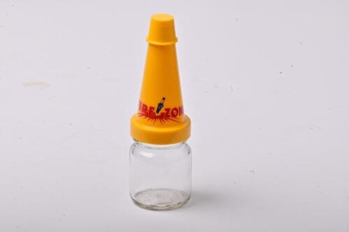 FIREZONE: A small NOS Firezone oil bottle with plastic pourer and cap