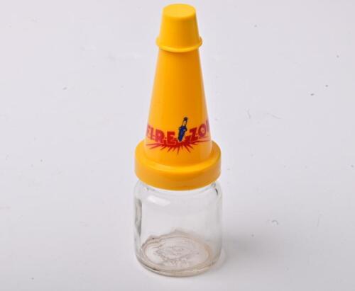 FIREZONE: A small NOS Firezone oil bottle with plastic pourer and cap