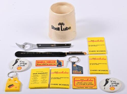 SHELL: A collection of Shell merchandise, including stickers, a mug, a pen, badges etc