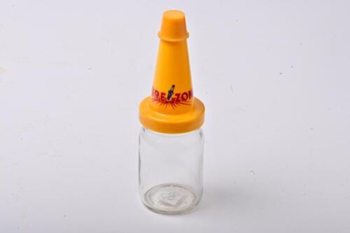 FIREZONE: A large NOS Firezone oil bottle with plastic pourer and cap, with UV damage to the pourer