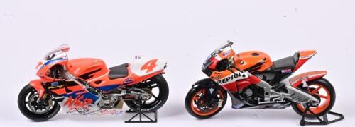 HONDA: Two 1:12 scale Honda racing motorcycles, one being Repsol Honda RC212V and one being Honda NSR #4 Mick Doohan, with slight paint damage and failed rear suspension, stands not included, both with no box