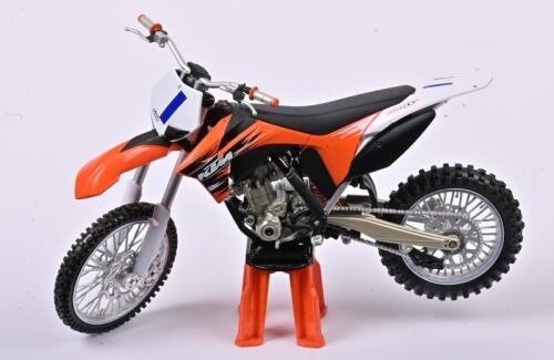 KTM: A 1:12 scale KTM 350 SX F 2011 motocross/dirt bike, with the stand