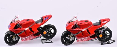 DUCATI: Two 1:12 scale Ducati Desmosedici V4 GP9, one being numbered #1 and one being numbered #27, stands not included, no box