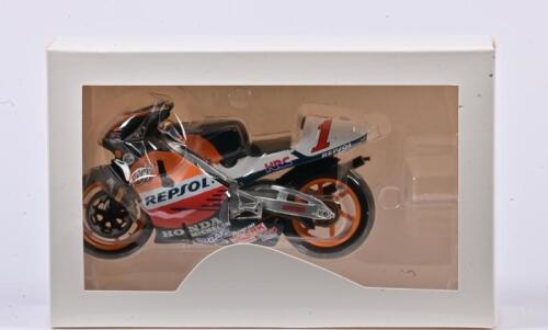 HONDA: A 1:12 scale Repsol Honda NSR Racing #1 riden by Mick Doohan, missing the stand, boxed