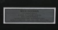 DOOHAN: A signed decorative framed collage featuring Mick Doohan&nbsp;with centre photo signed, with presentation metal plaque outlining career highlights, mounted framed and glazed, overall measurements 48cm high x 58cm wide - 3