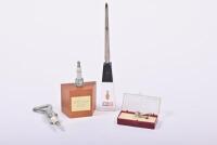 CHAMPION: A collection of Champion promotional items, including a letter opener and a bottle opener