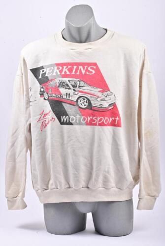 LARRY PERKINS: A signed Larry Perkins jumper, featuring him in his Holden