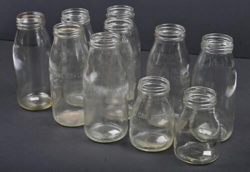 OIL BOTTLES: A collection of ten glass oil bottles, five imperial quarts, three quarts, one imperial pint and one pint, all with slight imperfections