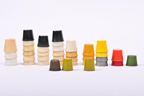 OIL POURER CAPS: A collection of thirty-seven oil bottle pourer caps, thirty-four plastic caps and three tin caps