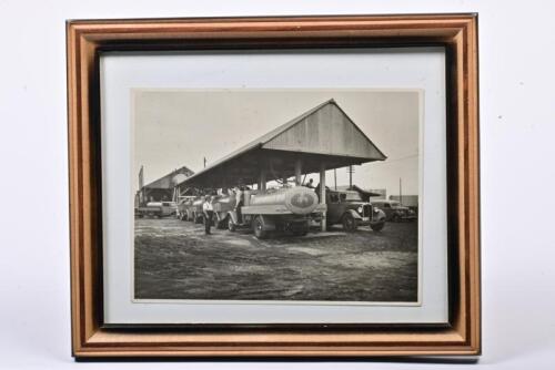 GOLDEN FLEECE: An early 1930s photo of Golden Fleece tankers being filled at the Sydney depot, image size 15.5 x 20.5cm, 24 x 29cm overall