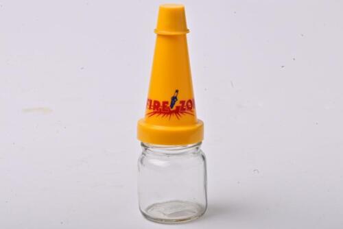 FIREZONE: A small NOS Firezone oil bottle with plastic pourer and cap