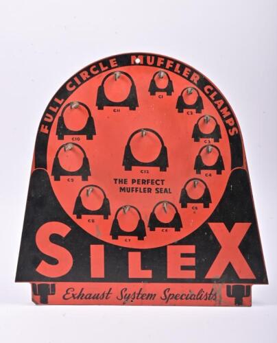SILEX: A masonite Silex muffler clamp wall mounted shop display, in the from of a clamp with hooks for holding various sizes of clamps, 55 x 55cm