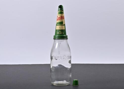 CASTROL WAKEFIELD: An one imperial quart Castrol Wakefield glass oil bottle with a rare NOS L SAE 20-20 W Castrol Wakefield motor oil tin pourer and cap with the sought after "Wakefield" inclusion in the "flash" logo