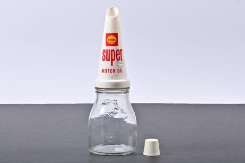 SHELL: A 1960s one pint glass oil bottle with Shell Super plastic oil pourer and dust cap