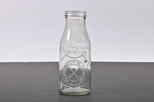 ATLANTIC: A one quart embossed Atlantic Shield embossed glass oil bottle