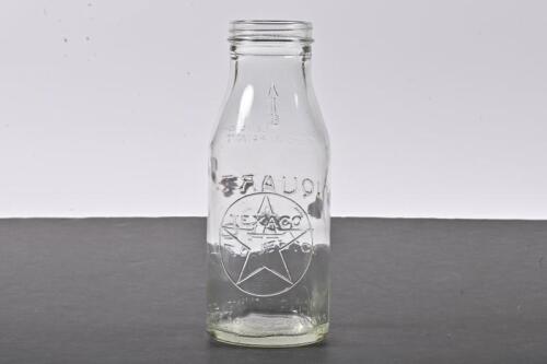 TEXACO: A one quart embossed Texaco embossed glass oil bottle