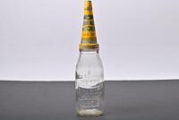 GOLDEN FLEECE: An early 1940s one imperial quart embossed HC Sleigh, Golden Fleece glass oil bottle with SAE 30 tin oil pourer and dust cap