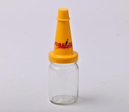 FIREZONE: A large NOS Firezone oil bottle with plastic pourer and cap