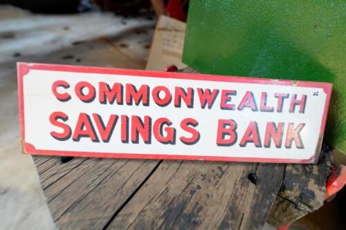 A freestanding countertop &lsquo;Commonwealth Savings Bank&rsquo; early enamel sign