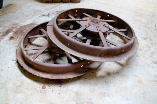 Two large early steel wheels