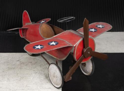 CHILDRENS AEROPLANE: A circa 1930s childrens pedal car plane, 66cm high, 118cm wide, 102cm deep