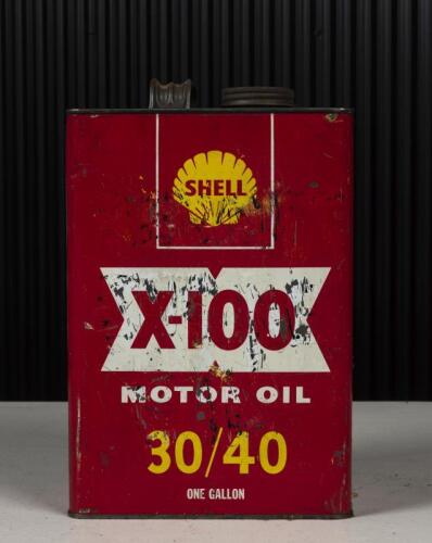 SHELL: A vintage one-gallon Shell motor oil with repaired handle