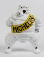 MICHELIN: A modern aluminium figure of smoking Bibendum figure cast after the original 1920 figure used on trolley compressors, 17cm high.