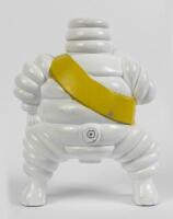 MICHELIN: A modern aluminium figure of smoking Bibendum figure cast after the original 1920 figure used on trolley compressors, 17cm high. - 2