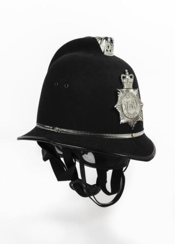 BOBBY: An original 21st Century English Metropolitan Police bobby helmet by Custodian Helmet in a large size, 25cm high
