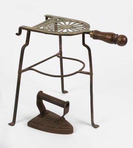 CLOTHES IRON: A circa 1890s Salter's clothes iron and an associated later wrought iron and brass stand, the stand 33cm high