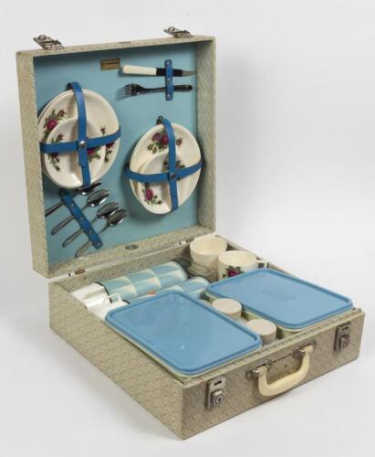 PICNIC HAMPER: A 1960s Brexton picnic hamper for four, 14cm high, 39.5cm wide, 39.5cm deep